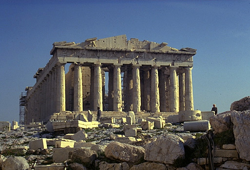 The Parthenon, western facade. - View from east of the Temple of Athena Nike. The large limestone boulders in the forground are part of the Mycenaean fortification wall. by Kevin T. Glowacki and Nancy L. Klein