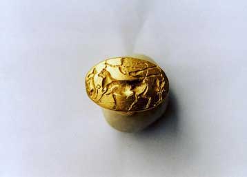 The long-lost 'Theseus Ring,' a gold ring found in the Plaka district of Athens in the 1950s and generally dismissed as a fake, has been identified by Greek archaeologists as a genuine 15th century BC artifact, reports said Wednesday. <br><br>

The Greek press had reported the discovery of a gold signet ring, with dimensions 2.7 x 1.8 cm dating from the Minoan period, and the National Archaeological Museum wanted to purchase it for 75,000 euros from the woman who owned it. <br><br>

There was a huge debate about its authenticity until a panel of experts from the Culture Ministry declared the piece to be genuine. <br><br>

The ring, which depicts a bull-leaping scene, is believed to come from the area of Anafiotika in the Athens ancient city centre of Plaka. The scene also includes a lion to the left and a tree to the right. <br><br>

According to ancient Greek mythology, Prince Theseus was the son of King Aegeus of Athens. During this period, the Minoans under the leadership of King Minos, who lived on the island of Crete, had a very strong navy and often attacked various Greek cities, including Athens. <br><br>

King Aegeus had an agreement with King Minos that if Minos would leave Athens in peace, Aegeus would send seven Athenian boys and seven Athenian girls to Crete every nine years, to be eaten by a monster that lived on Crete, the Minotaur. <br><br>

Determined to slay the monster, Theseus joined the children on the next voyage despite pleas from his father. King Aegeus made Theseus promise to change the sails on the boat from black to white if he managed to come home alive. <br><br>

After killing the Minotaur and sailing back towards Athens near Sounion, Theseus had forgotten to change the sail from black to white. When King Aegeus saw the black sail he thought Theseus was dead and jumped off a cliff, killing himself. 